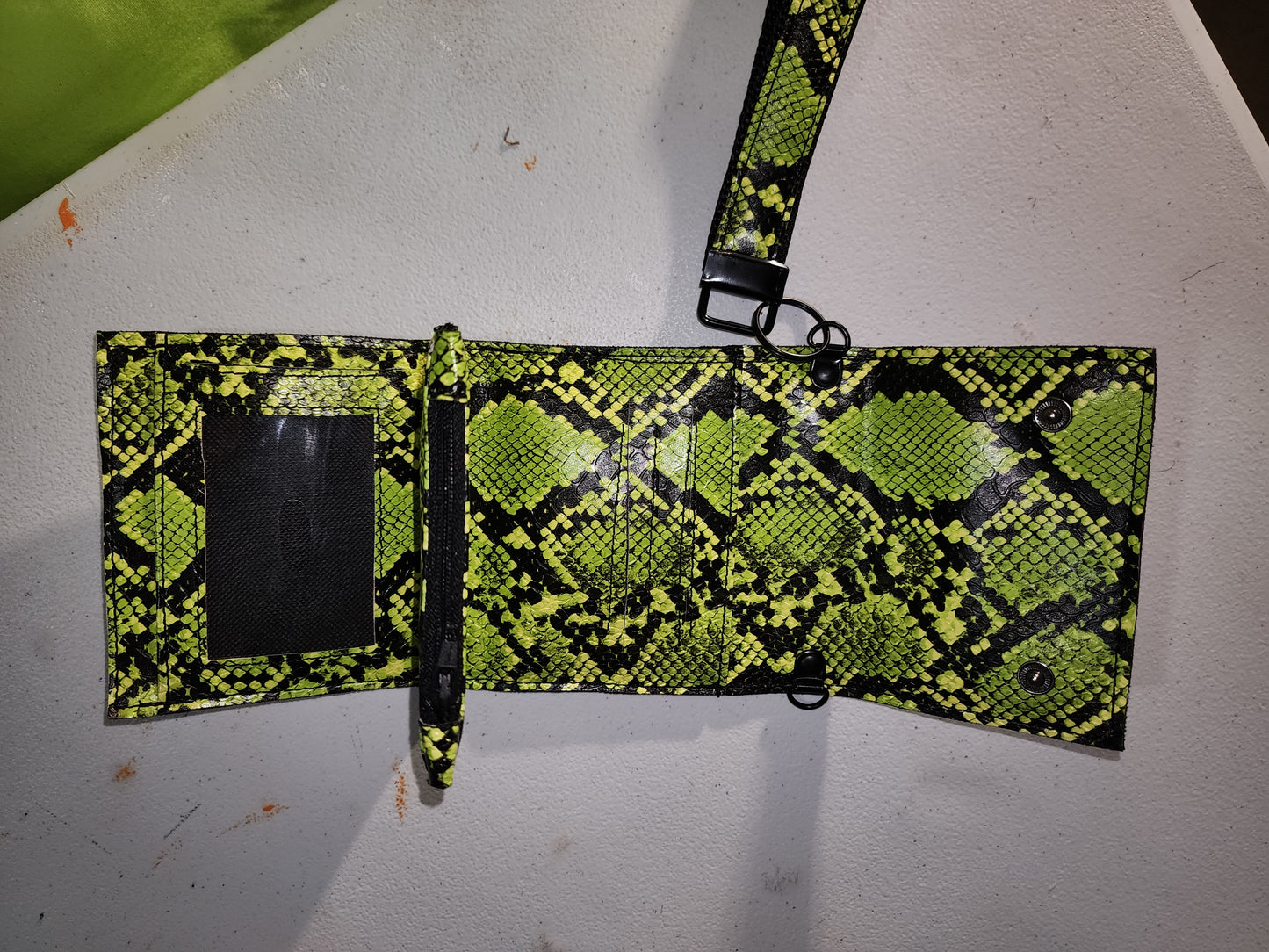 Snakeskin mini wallet.