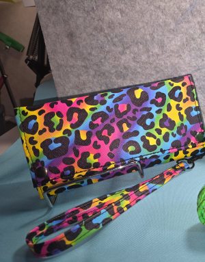 Handmade Draco rainbow leopard trifold wallet with multicolor animal print, snap closures and matching wristlet strap