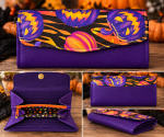 Handmade Pumpkin NCW Wallet with purple vinyl and colorful jack-o'-lantern flap