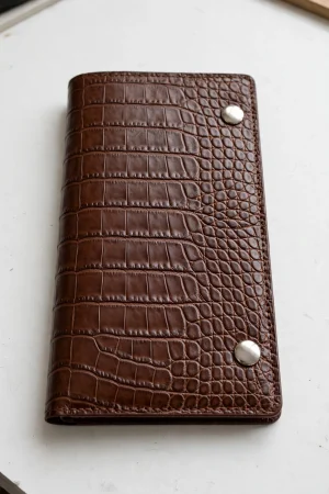 Mini Draco Bifold Wallet sewing pattern with examples of handmade compact bifold wallets in different fabrics.