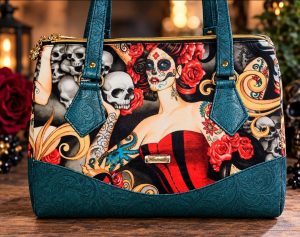Alexander Henry Sugar Skull Bowler Shoulder Bag with teal embossed vinyl and red roses