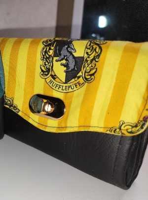 Handmade Hufflepuff Mini NCW Wallet with yellow house crest fabric, black vinyl exterior and gold-tone turn-lock closure